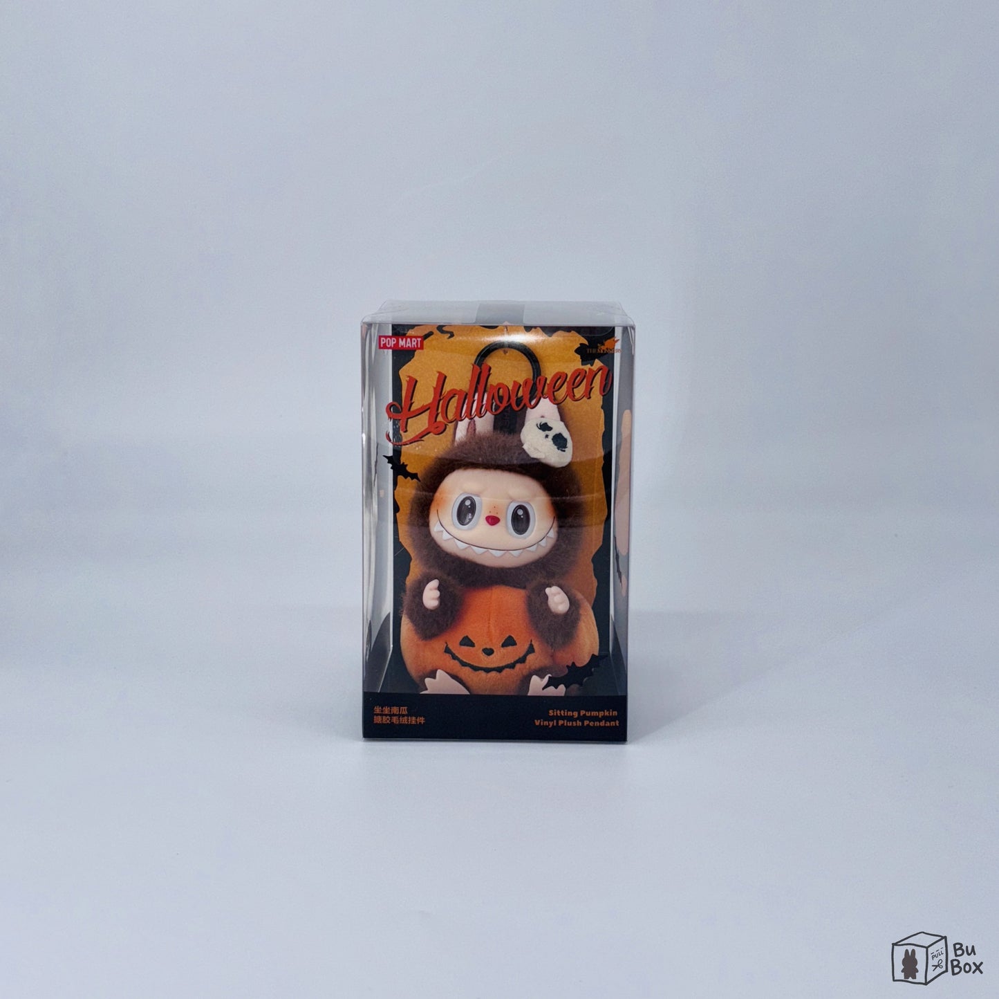 THE MONSTERS Labubu Happy Halloween Party Series Sitting Pumpkin Vinyl Plush Pendant featuring a cute Labubu character sitting on a pumpkin, perfect for Halloween decorations and Labubu collectors.